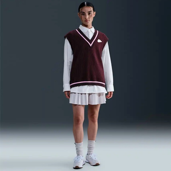 Historical vintage photograph showing early knitted vest origins as cricket sportswear worn by English athletes in early 1900s demonstrating practical sleeveless design