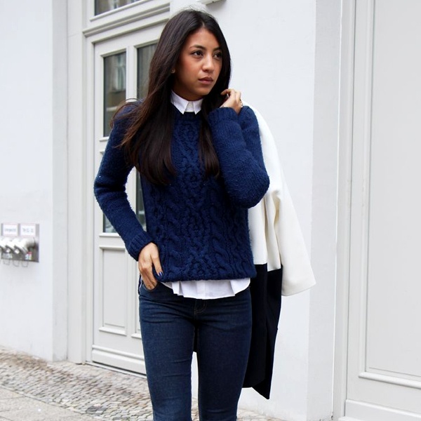 Classic navy blue V-neck sweater vest and white shirt color combination creating crisp contrast for everyday versatile styling