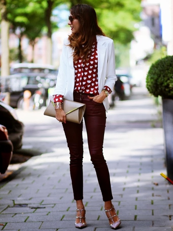 Chic white blazer layered over heart-print top with burgundy jeans for Valentine's day out